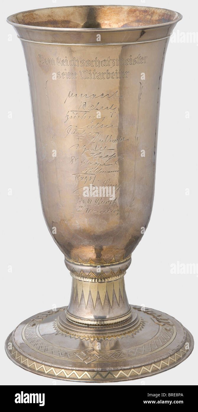 Franz Xaver Schwarz (1875 - 1947), a silver goblet, celebrating 10 Years as National Treasurer for the NSDAP, 1935 Gahr Workshop, Munich. Hand-hammered, silver goblet, partially gilded with the party eagle on the front above the engraved date '27.II. 1925 - 27.II 1935'. On the reverse the dedication 'Dem Reichsschatzmeister seine Mitarbeiter', (To the National Treasurer from His Colleagues) with fifteen signatures. The large base bears the surrounding inscription 'Treue um Treue' in relief and a swastika. A small silver plate on the bottom stamped with 'Gahr Mü, Stock Photo