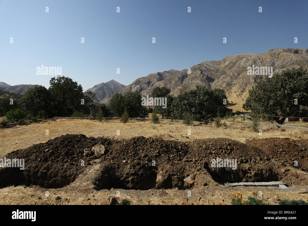 Fresh graves being dug in Mehmet Karasungur Cemetery which is burial site for fallen Kurdish fighters of the People's Defense Forces HPG the military wing of the Kurdistan Workers' Party PKK located in the Qandil Mountains a mountainous area of Iraqi Kurdistan near the Iraq Iran border Stock Photo