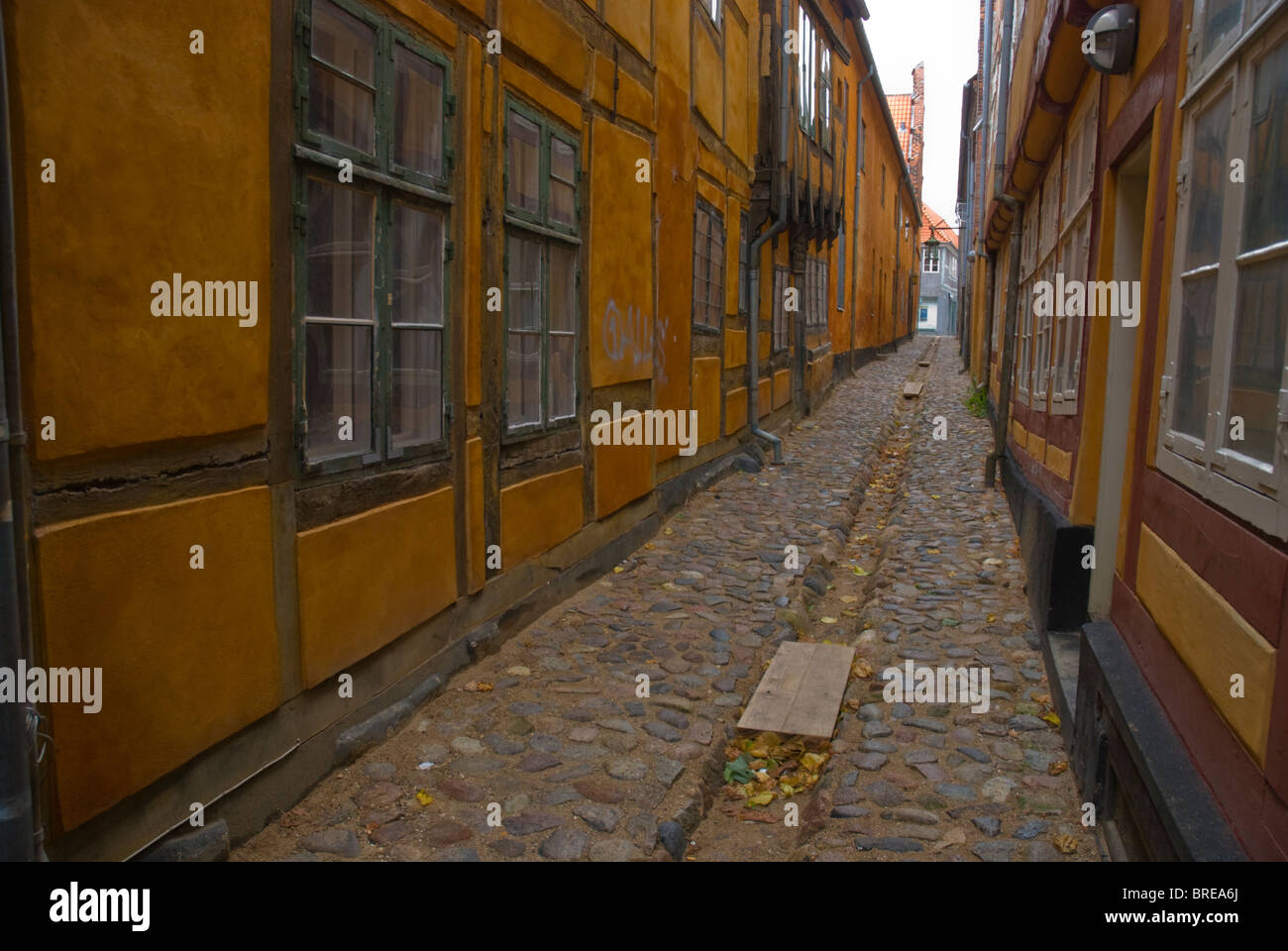 Narrow empty lane in medieval quarter Helsingor north Sjaelland Denmark Europe Stock Photo