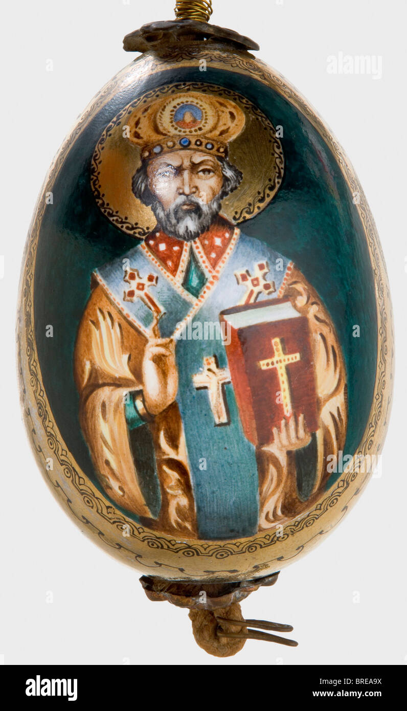 A painted easter egg, Russia, after 1900 Ceramic(?). Hand-painted depictions of the Virgin Mary and St. Nicholas in colour. Richly gilded. Height 10.5 cm. Cord suspension. historic, historical, people, 1900s, 20th century, object, objects, stills, clipping, clippings, cut out, cut-out, cut-outs, fine arts, art, art object, art objects, artful, precious, collectible, collector's item, collectibles, collector's items, rarity, rarities, man, men, male, Stock Photo