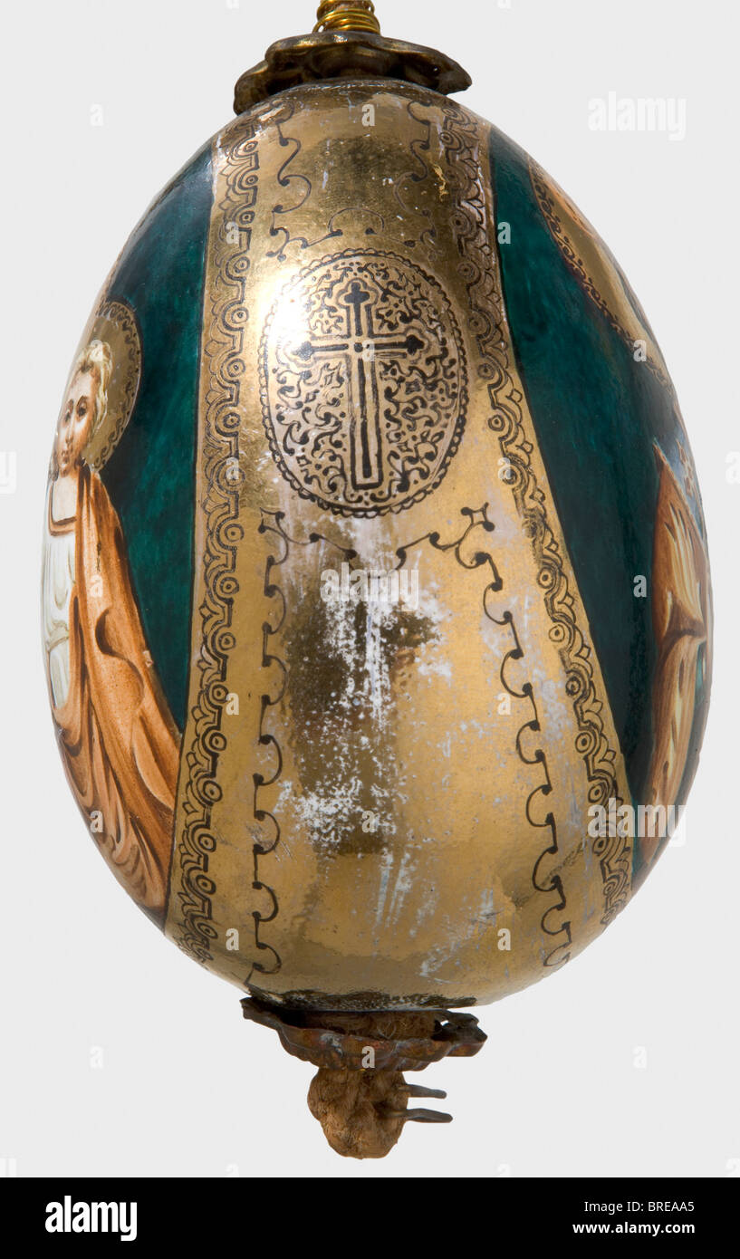 A painted easter egg, Russia, after 1900 Ceramic(?). Hand-painted depictions of the Virgin Mary and St. Nicholas in colour. Richly gilded. Height 10.5 cm. Cord suspension. historic, historical, 1900s, 20th century, object, objects, stills, clipping, clippings, cut out, cut-out, cut-outs, fine arts, art, art object, art objects, artful, precious, collectible, collector's item, collectibles, collector's items, rarity, rarities, Stock Photo