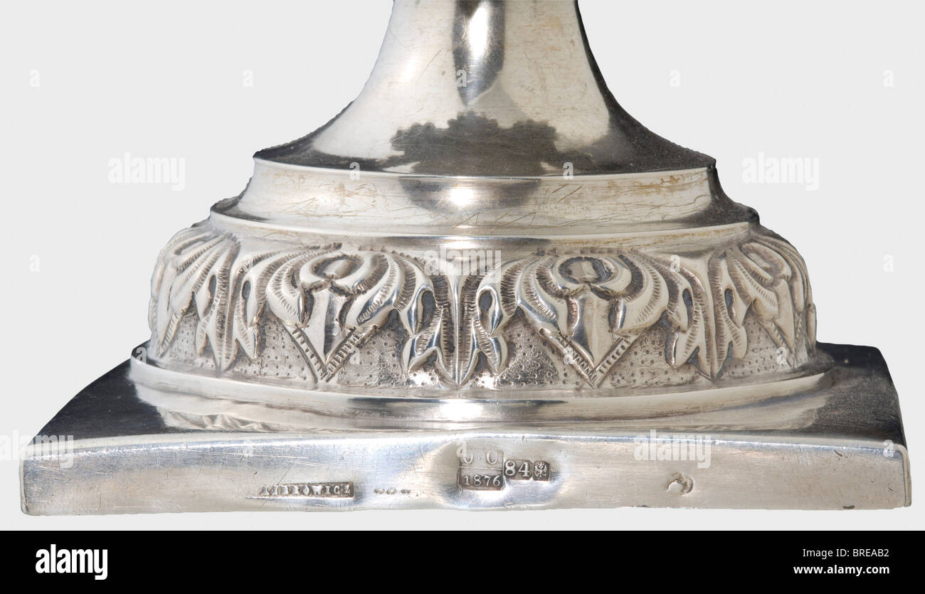 A silver candle stick, Minsk, 1876 Silver, the shaft in several sections, with palmette decoration in relief. The square base bears an illegible master's mark, '...owicz', the Minsk hallmark for '84' zolotniki, and the inspection master's mark 'OC' with the year '1876'. Height 37.5 cm. Weight 489 g. historic, historical, 19th century, object, objects, stills, clipping, clippings, cut out, cut-out, cut-outs, fine arts, art, art object, art objects, artful, precious, collectible, collector's item, collectibles, collector's items, rarity, rarities, Stock Photo