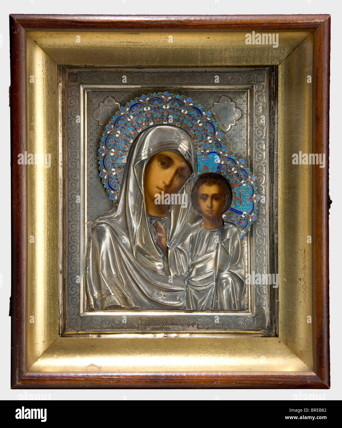 An icon of the Virgin Mary of Kazan, ca. 1900 Beautiful painting. Finely chased and engraved icon with silver oklad, sunburst with cloisonné enamel. Three illegible hallmarks ('88'?). In corresponding, partially gold-plated custom frame with hinged glass door. On the verso the inventory label 'H.V.v.W. G.v.R.' of the Duchess of Württemberg, Grand Duchess of Russia. Dimensions 28.5 x 24.5 cm. Provenance: Grand Duchess Vera Konstantinovna Romanova (1854 - 1912). historic, historical, people, 1900s, 20th century, 19th century, object, objects, stills, clipping, cl, Stock Photo