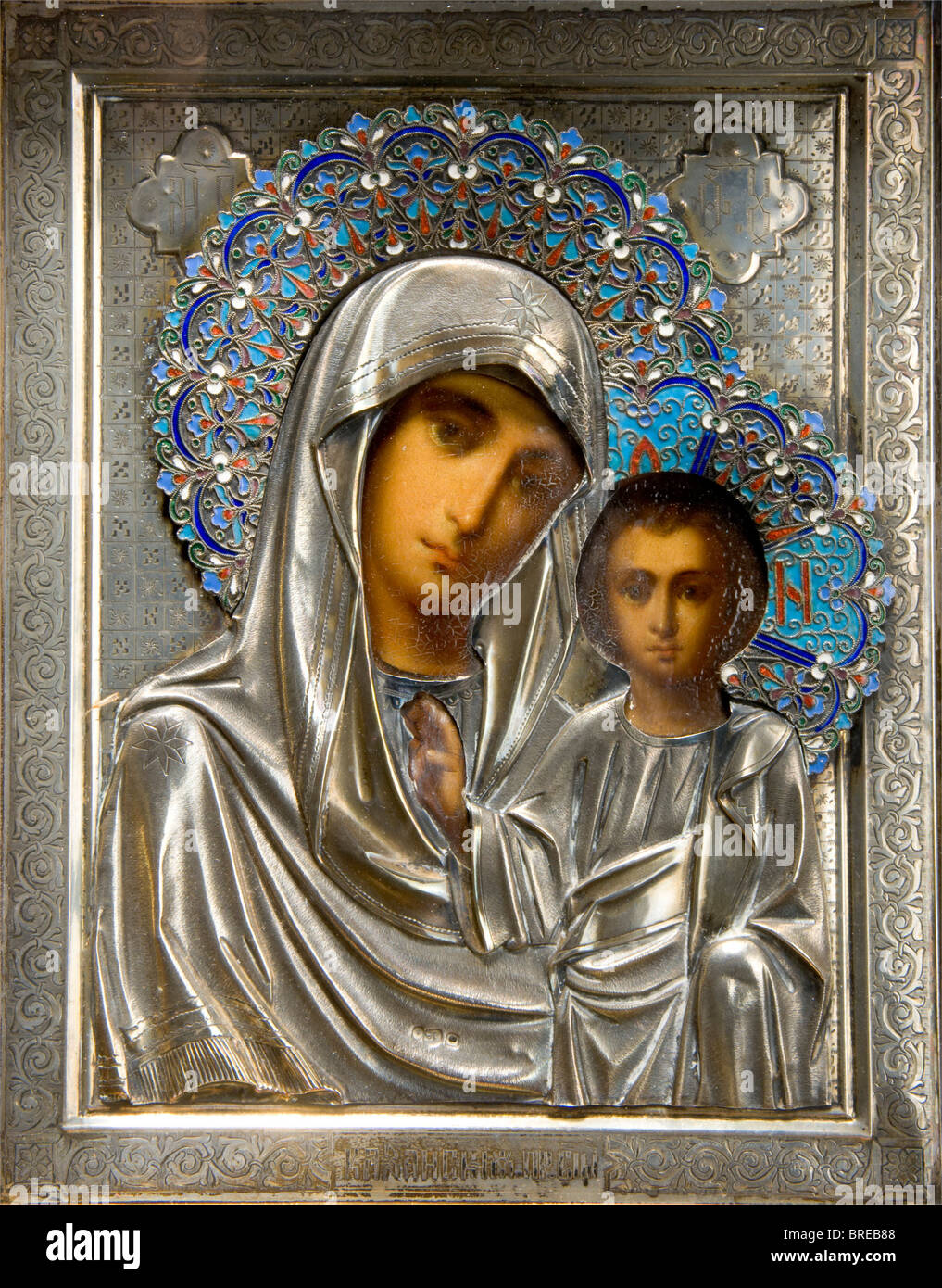 An icon of the Virgin Mary of Kazan, ca. 1900 Beautiful painting. Finely chased and engraved icon with silver oklad, sunburst with cloisonné enamel. Three illegible hallmarks ('88'?). In corresponding, partially gold-plated custom frame with hinged glass door. On the verso the inventory label 'H.V.v.W. G.v.R.' of the Duchess of Württemberg, Grand Duchess of Russia. Dimensions 28.5 x 24.5 cm. Provenance: Grand Duchess Vera Konstantinovna Romanova (1854 - 1912). historic, historical, people, 1900s, 20th century, 19th century, fine arts, art, art object, art objec, Stock Photo