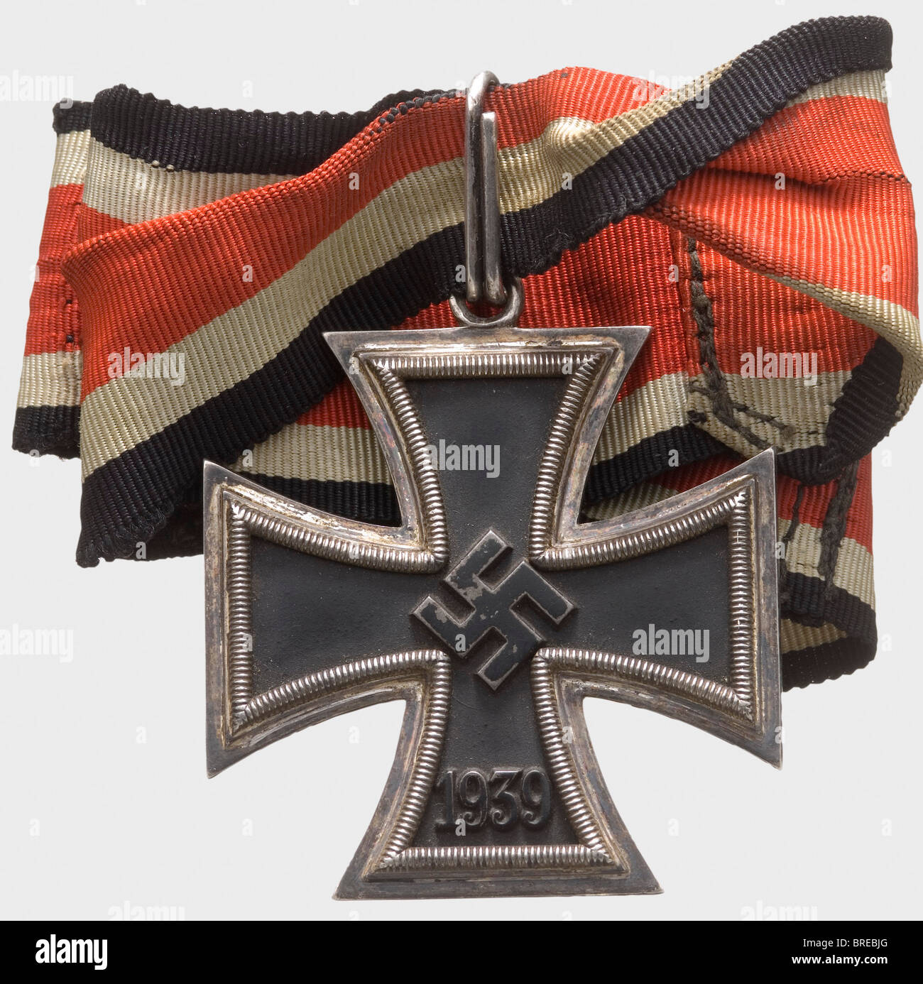A Knight's Cross, of the Iron Cross 1939 Blackened iron core with rim-high swastika. Silver frame and suspension ring, each with mark of fineness '800'. Customised neck ribbon made from sections of Knight's Cross as well as Iron Cross 2nd Class ribbon. Signs of wear (OEK 3821). Included is a current Niemann photo expertise dated May 2008. historic, historical, 1930s, 20th century, awards, award, German Reich, Third Reich, Nazi era, National Socialism, object, objects, stills, medal, decoration, medals, decorations, clipping, cut out, cut-out, cut-outs, honor, h, Stock Photo