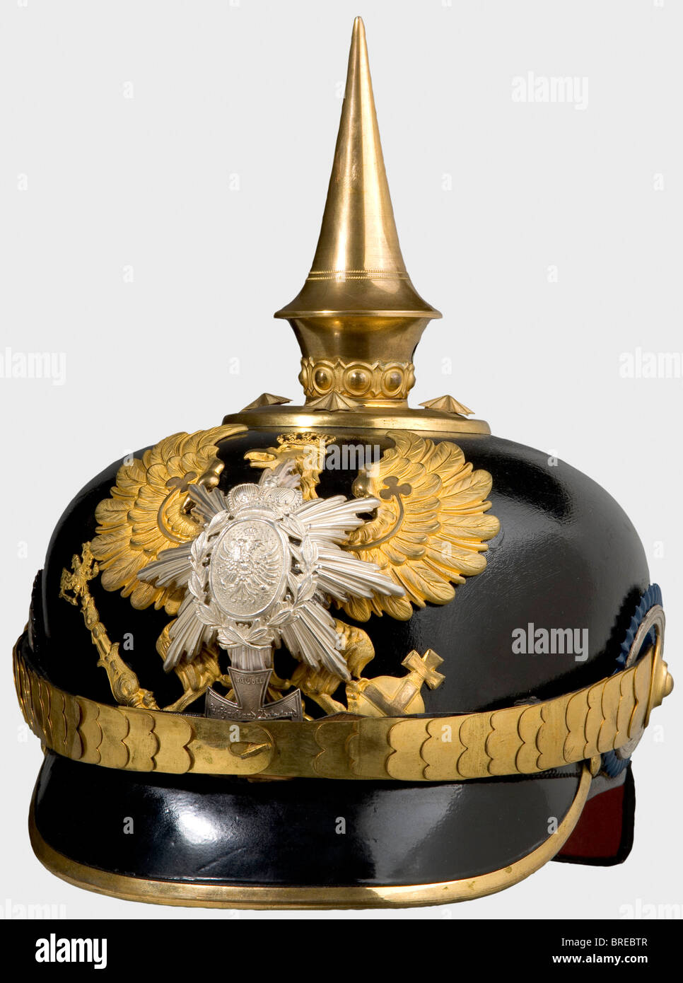 A helmet for reserve officers, of the III Battalion of the 7th Thuringian Infantry Regiment No. 96 Leather skull with gilt tombac mountings, line unit eagle without the Fatherland scroll, and the silver star and coat of arms of Schwarzburg-Rudolstadt as well as the Landwehr cross with the motto, "Mit Gott für Fürst..." (With God for Prince...), officer's cockades in blue/silver, and the imperial cockade. Brown ribbed silk lining. The gilding is still well preserved on all pieces. The helmet skull has probably been retouched. Size 56 1/2. Extremely rare helmet, , Stock Photo