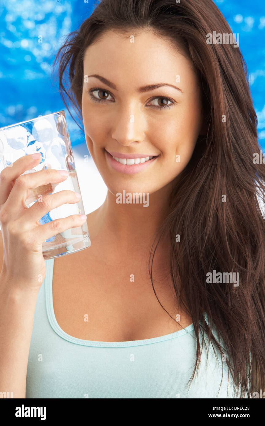 Young Woman Drinking Glass Of Water In Studio Stock Photo Alamy