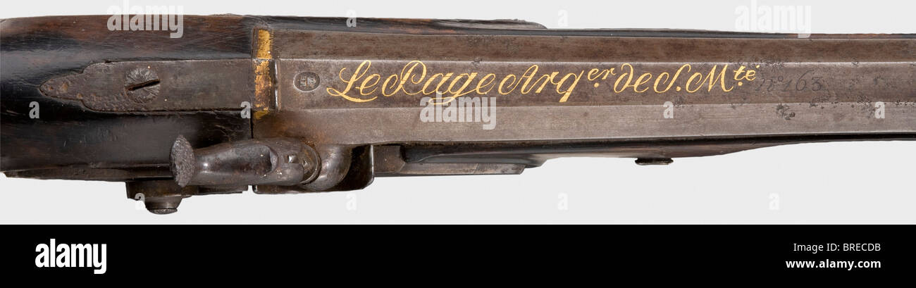 An M an XII pistol for general staff officers, Le Page, Paris, circa 1809. Octagonal rifled barrel in 17 mm calibre, with the maker's inscription in gold, 'Arquebusier de S. Mte.', and the inscription, 'no 163' on top of the barrel. Colour case-hardened, converted percussion lock with another maker's inscription. Walnut full stock with smooth iron furniture and a silver pommel cap in the shape of a Medusa's head. Wooden ramrod with iron tip. Iron parts are pitted and stained in places, with a small crack on the side plate. Shows signs of age and use. Length 36 , Stock Photo