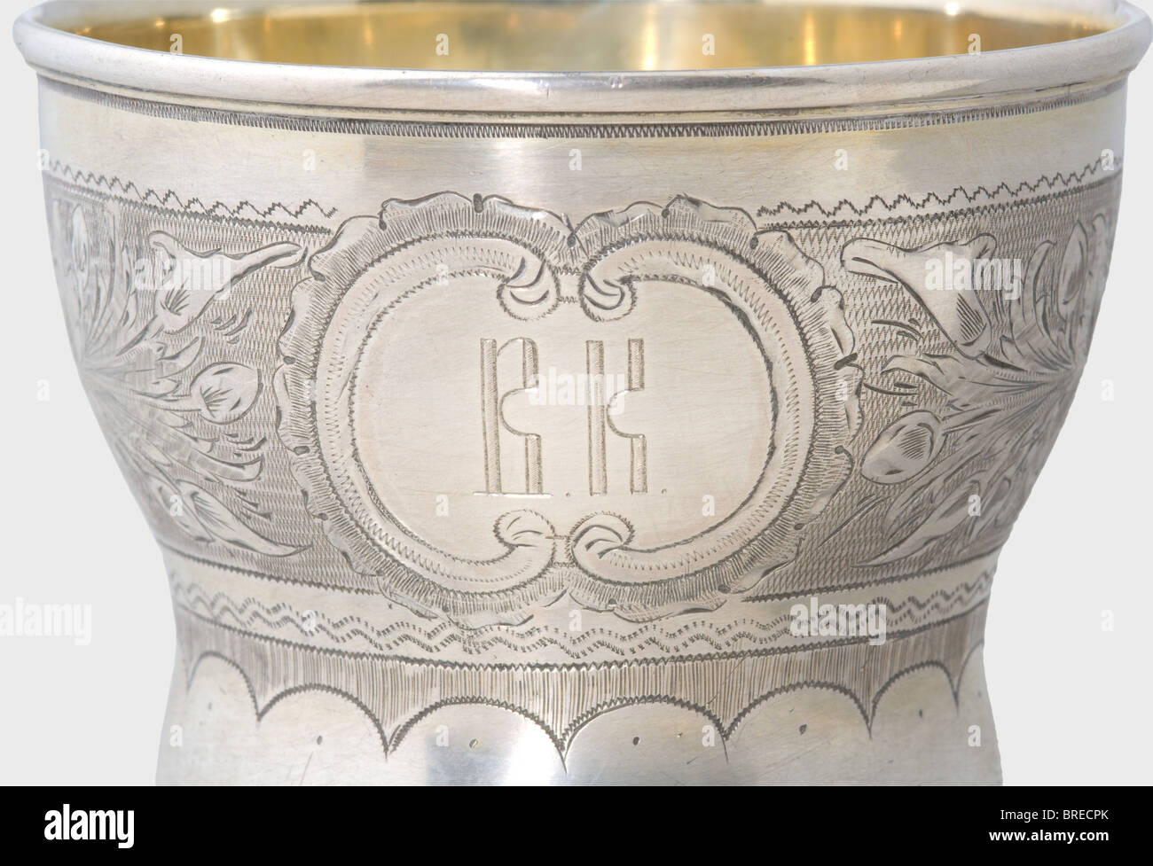 A silver tea cup and saucer, Moscow, 1867. Silver, gilt in places and with delicate floral engraving. The cup displays the monogram 'V.K.' in front. Each piece bears the master's mark, 'NA', the Moscow hallmark for '84' zolotniki, the inspecting master's mark 'BC', and the year '1867' on the bottom. Height of the cup 8.5 cm. Diameter of the saucer 13.5 cm. Total weight 199 g. Provenance: Grand Duchess Vera Konstantinovna Romanova (1854 - 1912). historic, historical, 19th century, dish, dishes, cup, cups, object, objects, stills, clipping, clippings, cut out, cu, Stock Photo