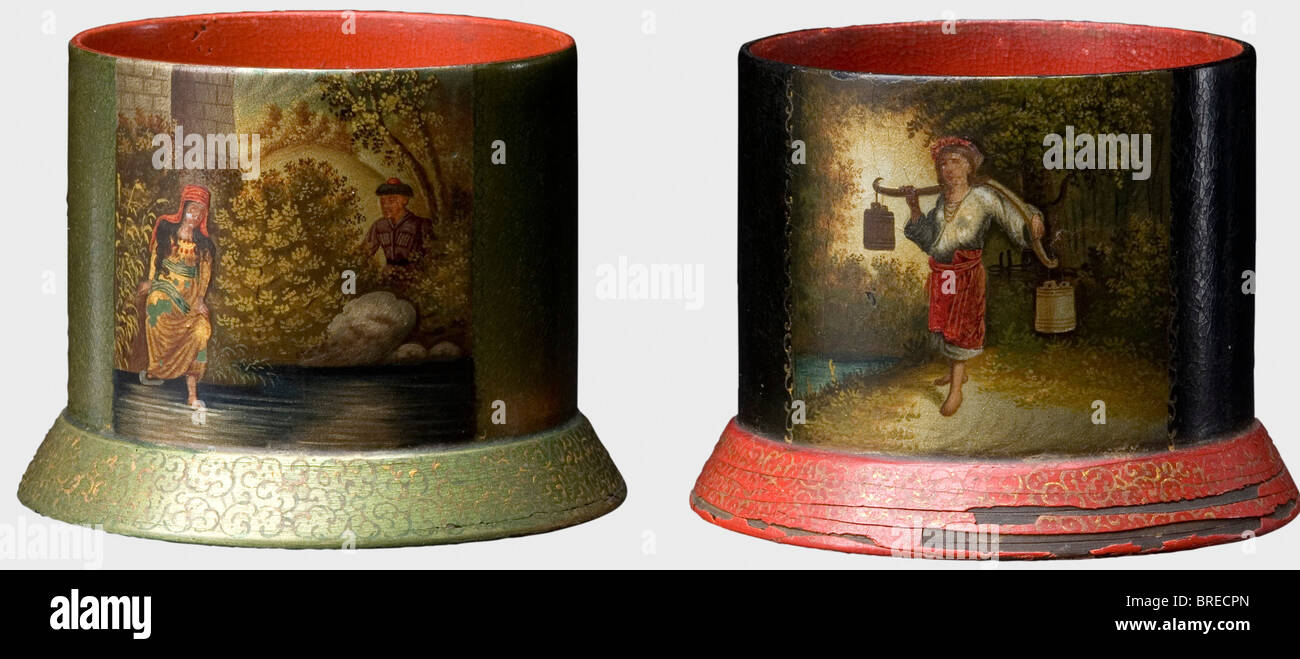 Two painted tea glass holders, Court Purveyor Lukutin, Moscow, circa 1880/90 Black/red and black/green lacquered tea glass holders with peasant and amorous scenes. The Cyrillic signature, 'F.N.L.' with the double-headed eagle on the bottom of each piece. Height of each 6.5 cm. Diameter of each 7 cm. Provenance: Grand Duchess Vera Konstantinovna Romanova (1854 - 1912). historic, historical, 19th century, vessel, vessels, object, objects, stills, clipping, clippings, cut out, cut-out, cut-outs, Stock Photo