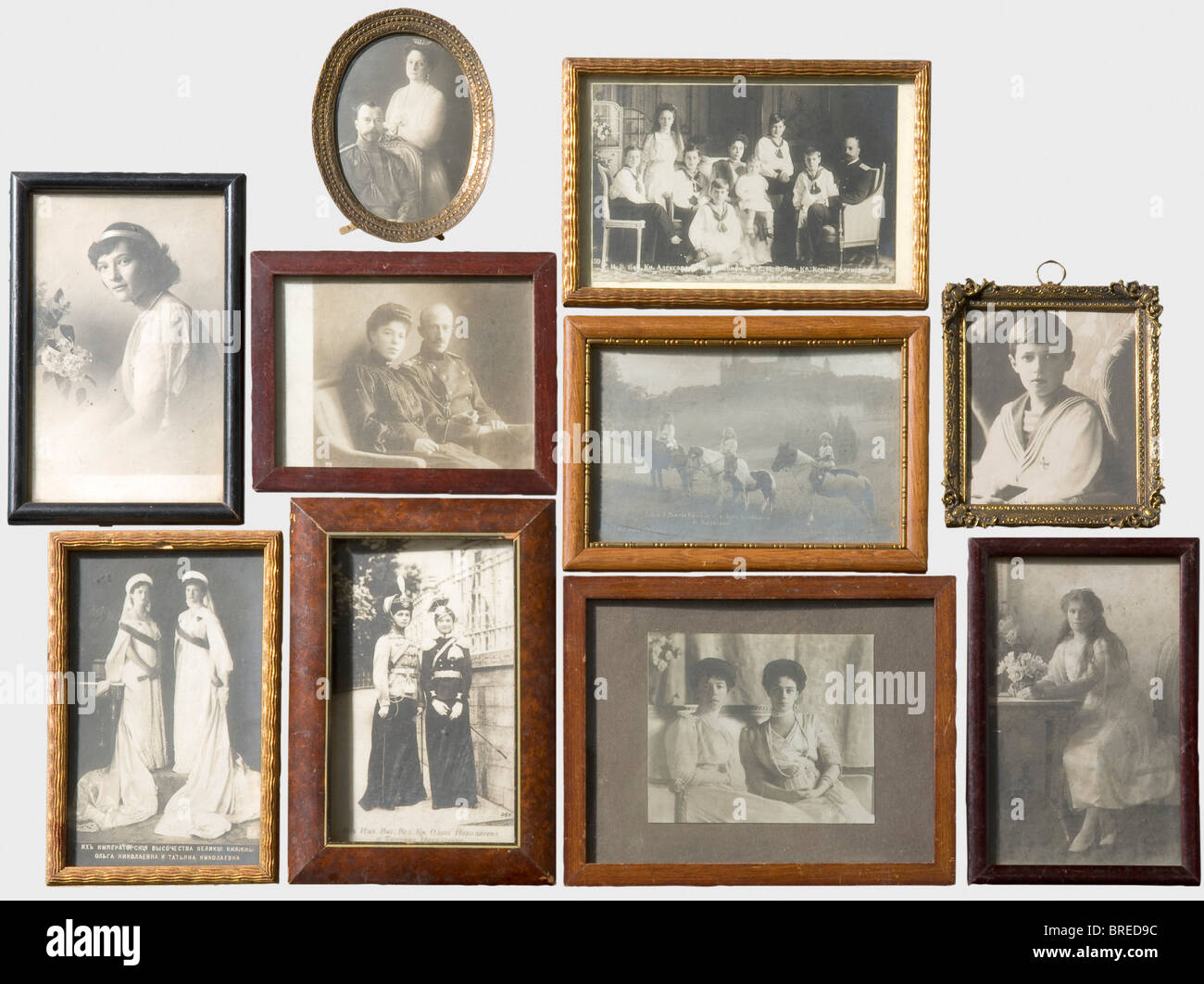 Eleven framed photographs, of the Tsar's family Tsar Nicholas II with Alexandra Fedorovna, Tsarevich Alexej, Grand Duchesses Olga, Tatiana, and Maria Nikolaevna. Family photo of Grand Duke Alexander Michailovich, Grand Duchesses Olga and Ksenia Alexandrovna, and postcards, some with Cyrillic inscriptions. Inventory labels with numbers on the backs. Also a printed of King Karl of Württemberg, with the label 'ON Villa' on the back for the Grand Duchess Olga Nikolaevna. Differing frames. Provenance: Grand Duchess Vera Konstantinovna Romanova (1854 - 1912). histori, Stock Photo