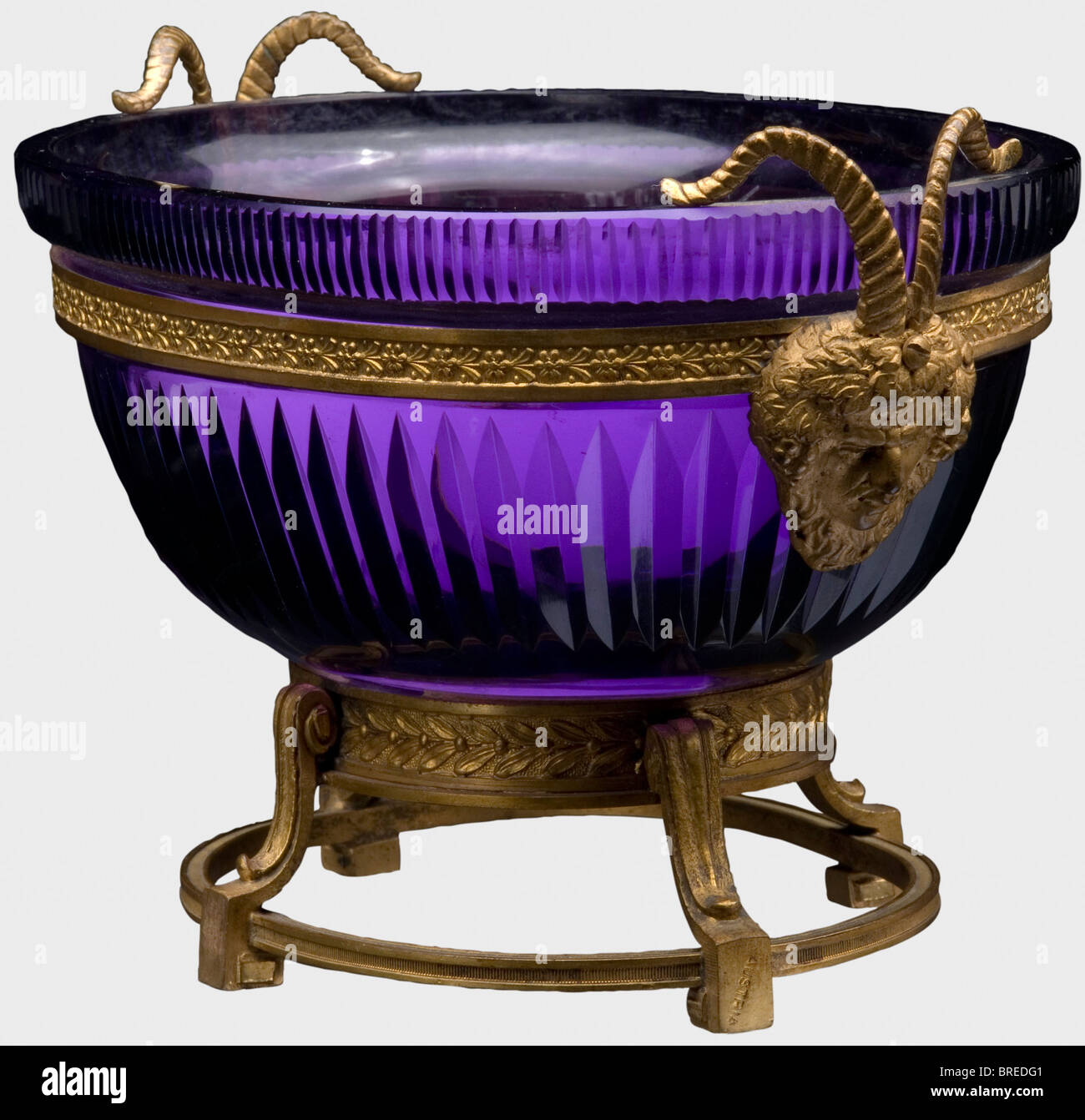 An Austrian confectionery dish, end of the 19th century Crystal glass flashed in violet. Fire-gilt bronze mountings with floral decoration, grotesque masks on the sides with rams horns. One foot is stamped 'Austria'. Dimensions ca. 12.5 x 19.5 x 13 cm. An inventory label 'H.V.v.W., G.v.R.' for Duchess Vera of Württemberg, Grand Duchess of Russia, on the bottom. Provenance: Grand Duchess Vera Konstantinovna Romanova (1854 - 1912). historic, historical, 19th century, vessel, vessels, object, objects, stills, clipping, clippings, cut out, cut-out, cut-outs, Stock Photo