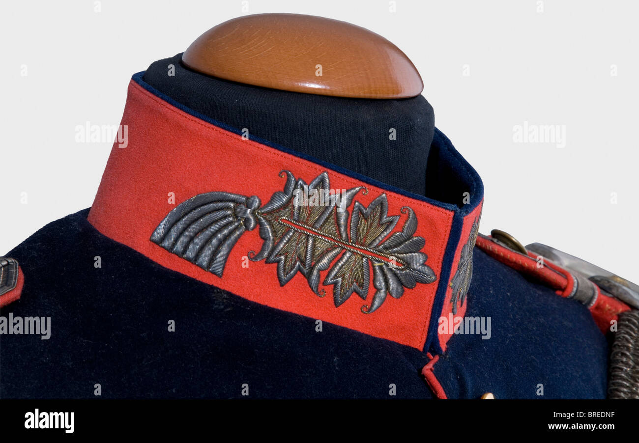 A tunic for a Prussian major general, model 1900 Dark blue wool cloth, old pattern Larisch gold embroidery (toned) on the ponceau-red collar and facings. Tail and lapel flaps lined in ponceau-red. Twelve gilt buttons. Epaulettes with single star of rank. Numerous orders loops. Small, mended moth holes. A rare uniform in colour fresh condition. historic, historical, 1900s, 20th century, Prussian, Prussia, German, Germany, militaria, military, object, objects, stills, clipping, clippings, cut out, cut-out, cut-outs, uniform, uniforms, outfit, outfits, textile, cl, Stock Photo