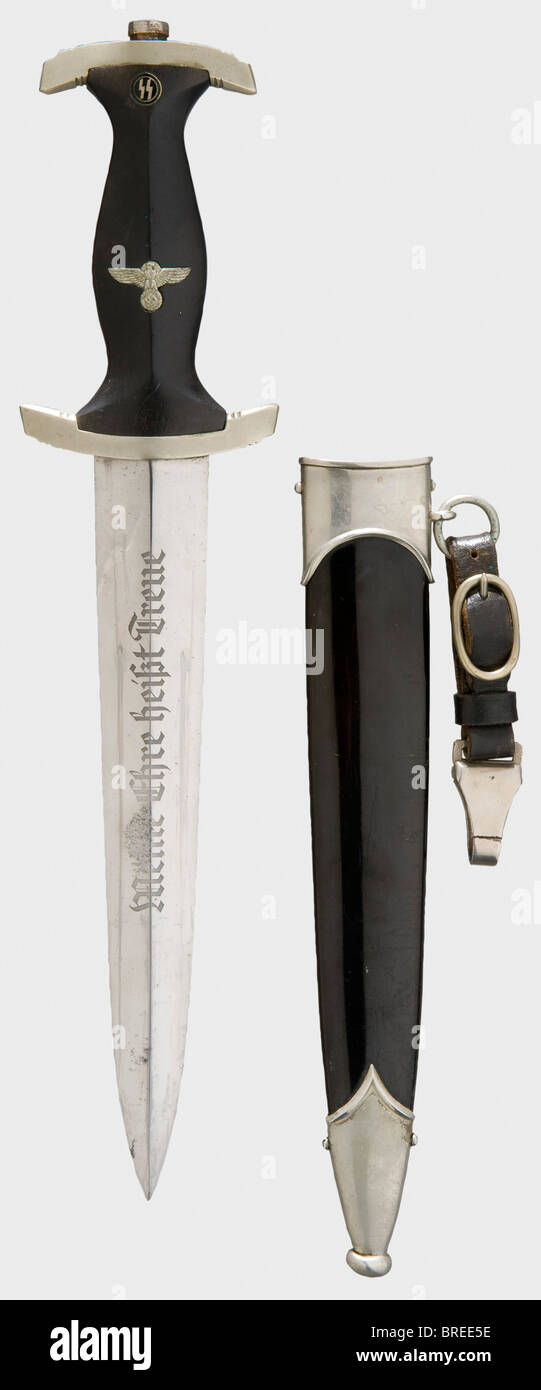 An SS service dagger, model 1933 Blade with etched device 'Meine Ehre heißt Treue', maker 'RZM M7/14 1936'. Rust scarring above 'Meine', otherwise nearly mirror-bright. Nickel silver quillons, black wood grip with inlaid nickel silver eagle and enamelled runic emblem, nickel-plated retaining nut. Black lacquered scabbard with nickel silver fittings (dented at the chape) and leather suspension with SS RZM stamping. Length 35 cm. historic, historical, 1930s, 20th century, Waffen-SS, armed division of the SS, armed service, armed services, NS, National Socialism, , Stock Photo