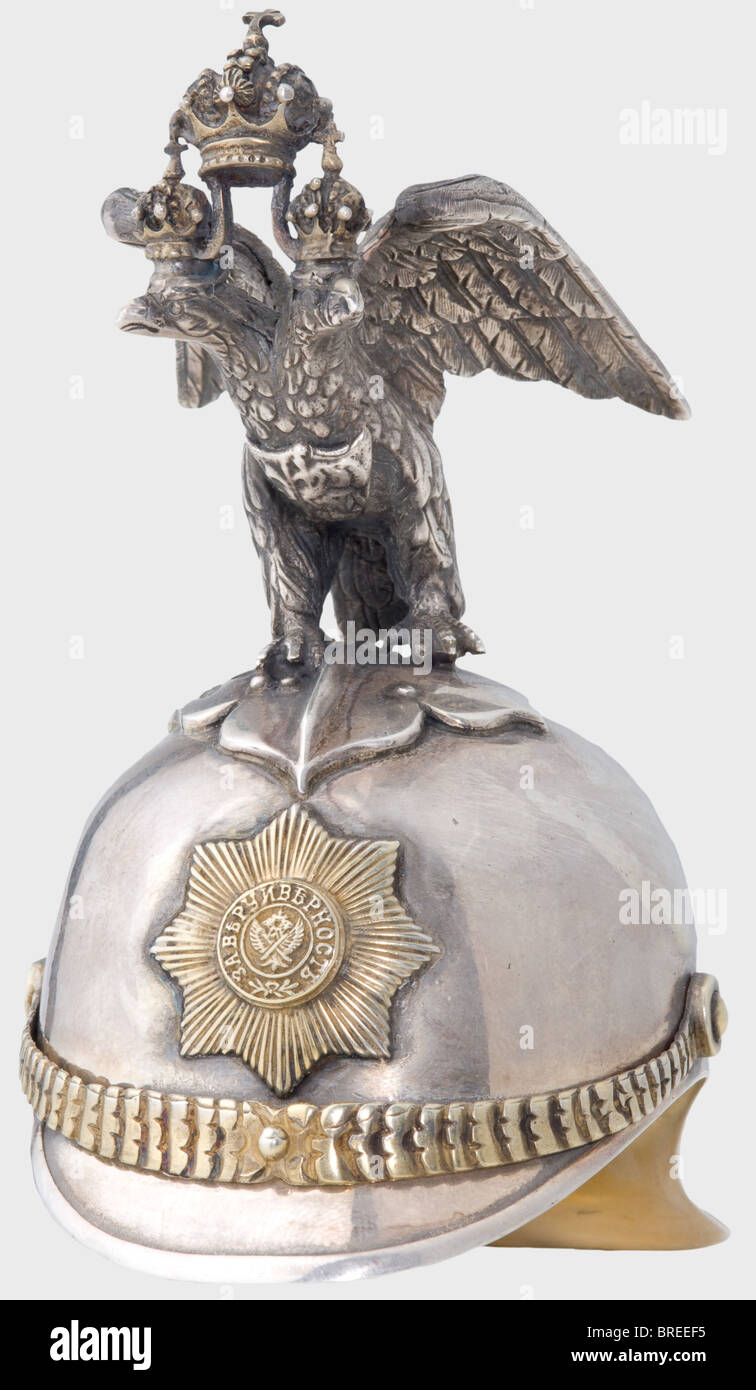 A silver miniature guard's helmet, Moscow, circa 1910 Silver with a gilt interior. Master's mark 'IP' and Moscow hallmark for '84' zolotniki. Height 10.5 cm. Weight 162 g. Possibly by Julius Rappoport. historic, historical, 1910s, 20th century, object, objects, stills, clipping, clippings, cut out, cut-out, cut-outs, helmet, helmets, headpiece, headpieces, utensil, piece of equipment, utensils, protection, headgear, headgears, uniform, uniforms, Stock Photo