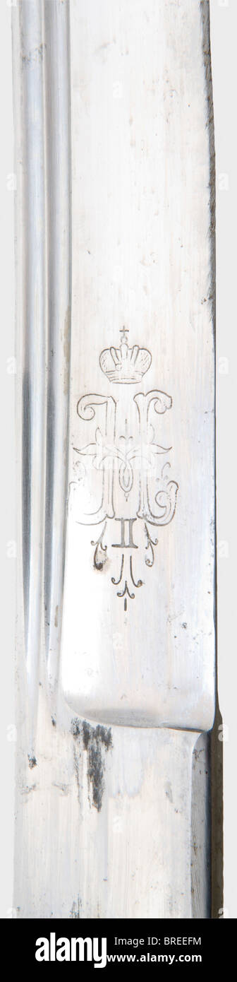 A model 1909 St. Anne's shashqa, for bravery The back of the blade marked in Cyrillic 'Zlat. Or. Fabr.', on the reverse a double-headed eagle, on the obverse side the crowned cipher 'N II', on the ricasso marked 'P' and 'Sch'. Brass hilt with remnants of gilding and the inscription 'Für Tapferkeit' (For Bravery), on the pommel cap small mark 'Sch. S.' (Schaaf und Söhne), and an applied St. Anne's medal (enamel damaged). Dark wooden grip. Leather scabbard with brass fittings, marked 'IM'. Length 90 cm. historic, historical, 1900s, 20th century, thrusting, thrust, Stock Photo