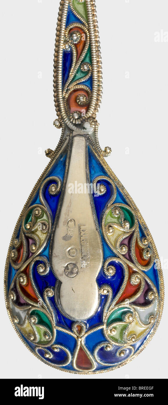 A plique-à-jour spoon, Purveyor to the Court Ivan Khlebnikov, Moscow, circa 1910 Gilt silver, coloured enamel work. The Cyrillic master's mark 'Khlebnikov' with the double-headed eagle, and the Moscow hallmark for '88' zolotniki, are in the bowl of the spoon. Length 16 cm. Weight 27 g. historic, historical, 1910s, 20th century, jewellery, jewelry, object, objects, stills, clipping, clippings, cut out, cut-out, cut-outs, Stock Photo