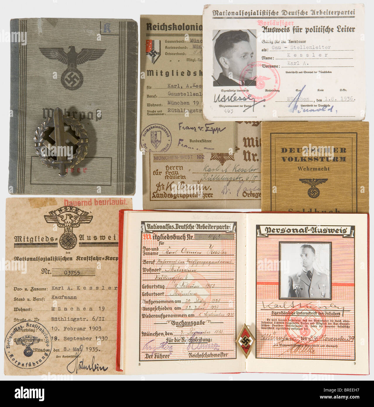 Gau department Leader and bearer of the Blood Order Karl Kessler, identity papers and documents Party membership book number '463', issued by the Gau Munich command on 24 November 1939 as a consultant in the Reich Propaganda Office. Photo in uniform wearing the Blood Order, with pasted-in authorisations for wear of the SA veterans cuff title, promotions to Sturmbann- and Obersturmbannführer, the NSDAP Long Service awards in Bronze and Silver, and Silesian Eagle 1st and 2nd classes. Kessler received Blood Order number 524 as a member of the Munich SA Regiment. P, Stock Photo