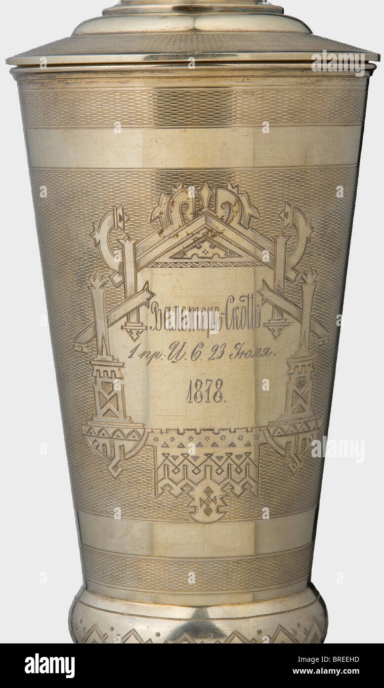 A vermeil goblet with lid, Sir Walter Scott Prize 1878, Fabian Frederick Allenius Gilt silver, the surface finely waffled and engraved, with a Cyrillic dedication on the front, 'Walter Scott - 1. Pr. I.S. 23 July 1878'. Master's mark 'FA', the St. Petersburg hallmark for '84' zolotniki, the Cyrillic inspecting master's mark 'MD', and the year '1877'. Total height 41.3 cm. Weight 959 g. Presumably a St. Petersburg prize for literature . historic, historical, 19th century, vessel, vessels, object, objects, stills, clipping, clippings, cut out, cut-out, cut-outs, Stock Photo