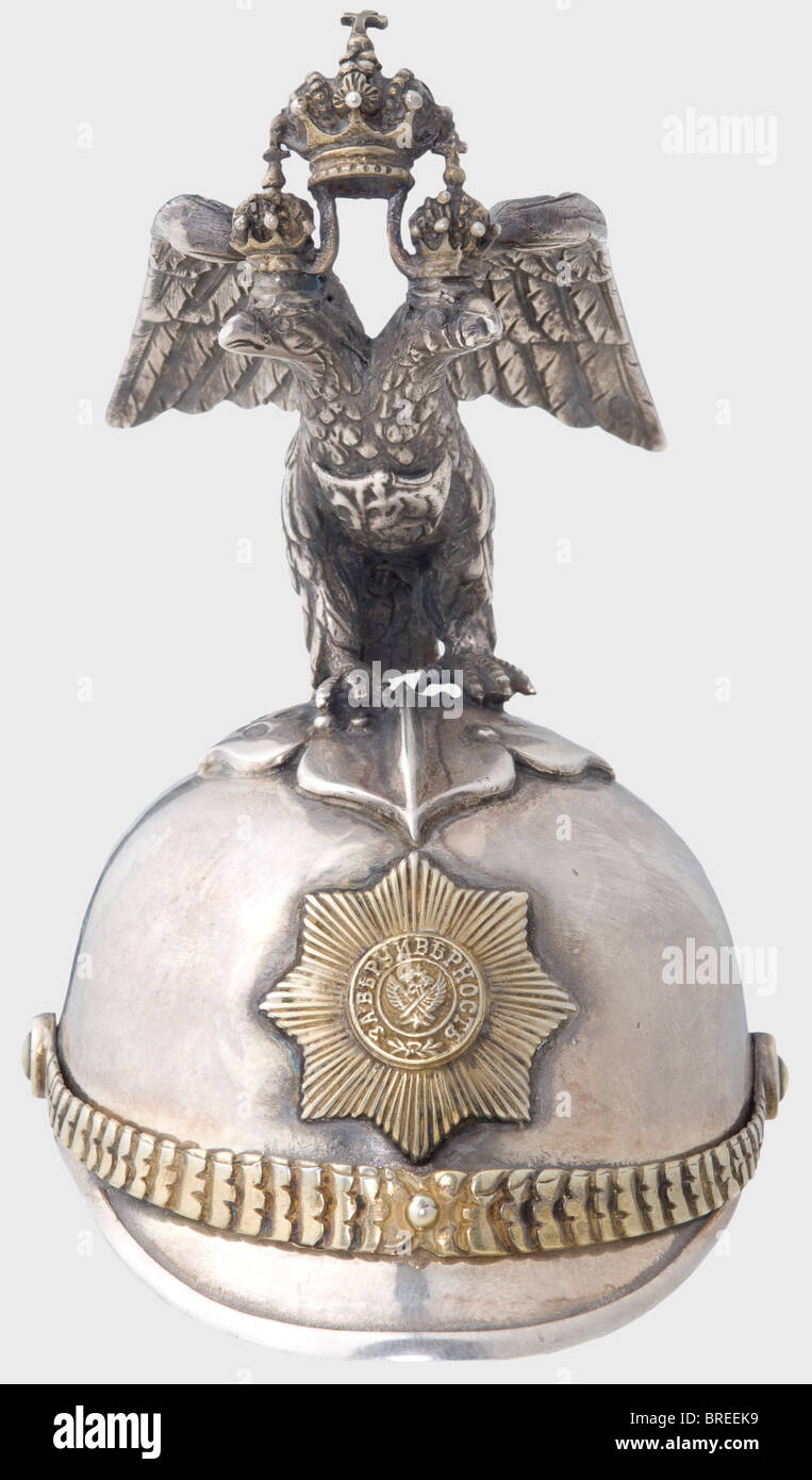 A silver miniature guard's helmet, Moscow, circa 1910 Silver with a gilt interior. Master's mark 'IP' and Moscow hallmark for '84' zolotniki. Height 10.5 cm. Weight 162 g. Possibly by Julius Rappoport. historic, historical, 1910s, 20th century, object, objects, stills, clipping, clippings, cut out, cut-out, cut-outs, helmet, helmets, headpiece, headpieces, utensil, piece of equipment, utensils, protection, headgear, headgears, uniform, uniforms, Stock Photo