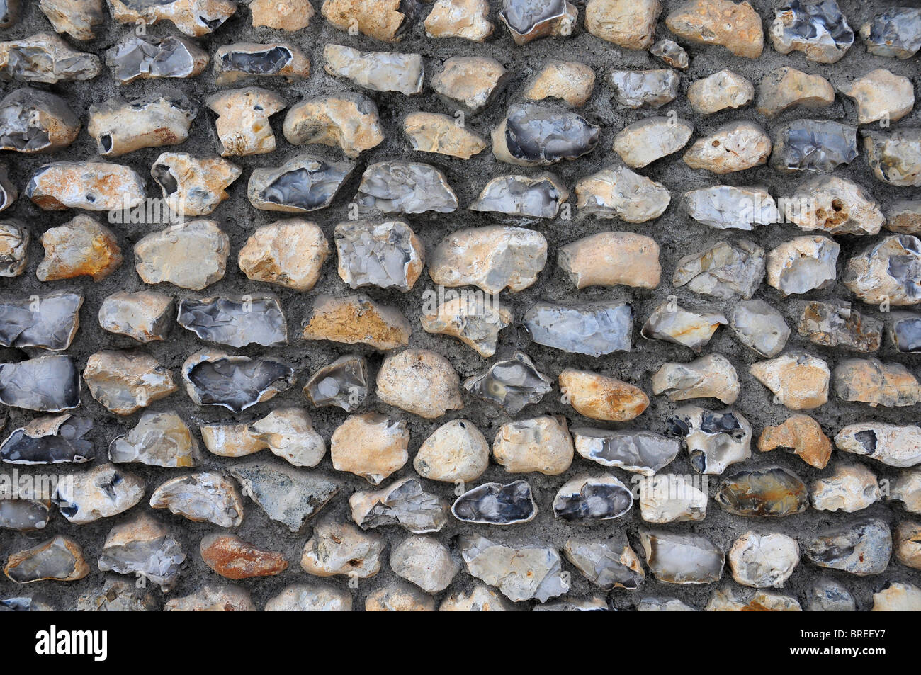 Close up of modern flintwork in Chichester. Some flints knapped. Some whole. Stock Photo