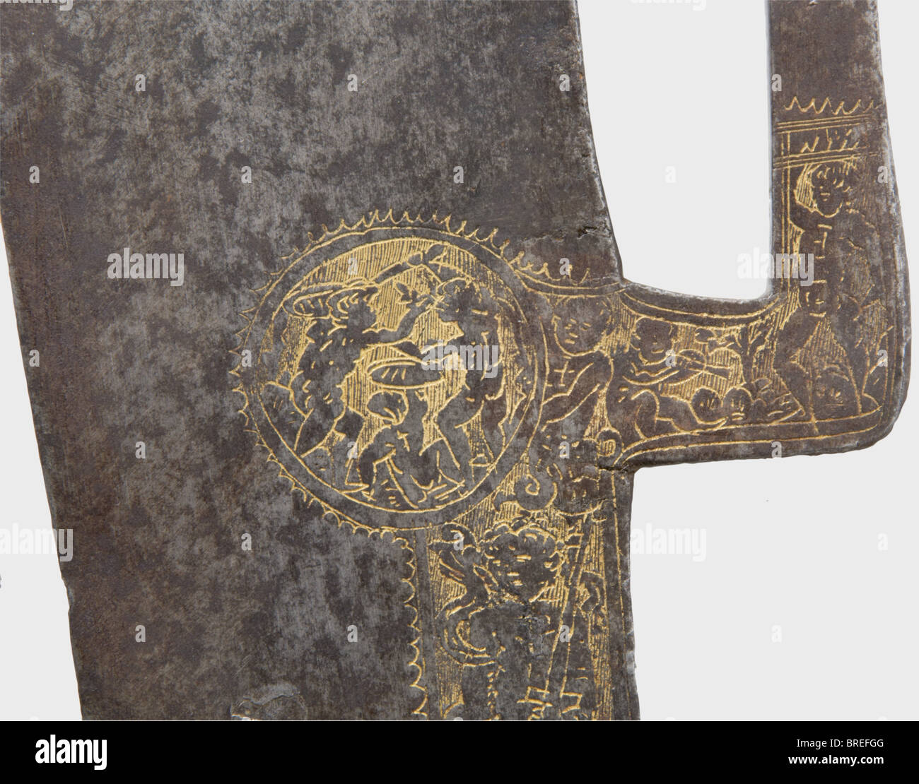 A fine Italian etched glaive, circa 1480/90 Heavy single-edged blade, double-edged towards the reinforced point of diamond section. At the back an angled grappling hook. Rectangular socket retaining one intact languet. The socket and blade base bear finely etched and gilt ornamentation, at the socket a depiction of Jesus with St. George while the blade shows depictions of various prophets beneath St. Sebastian and David(?). At the base of the grappling hook, on each side cartouches with embattled putti, the hook itself with a décor of tendrils. Length 79.5 cm. , Stock Photo