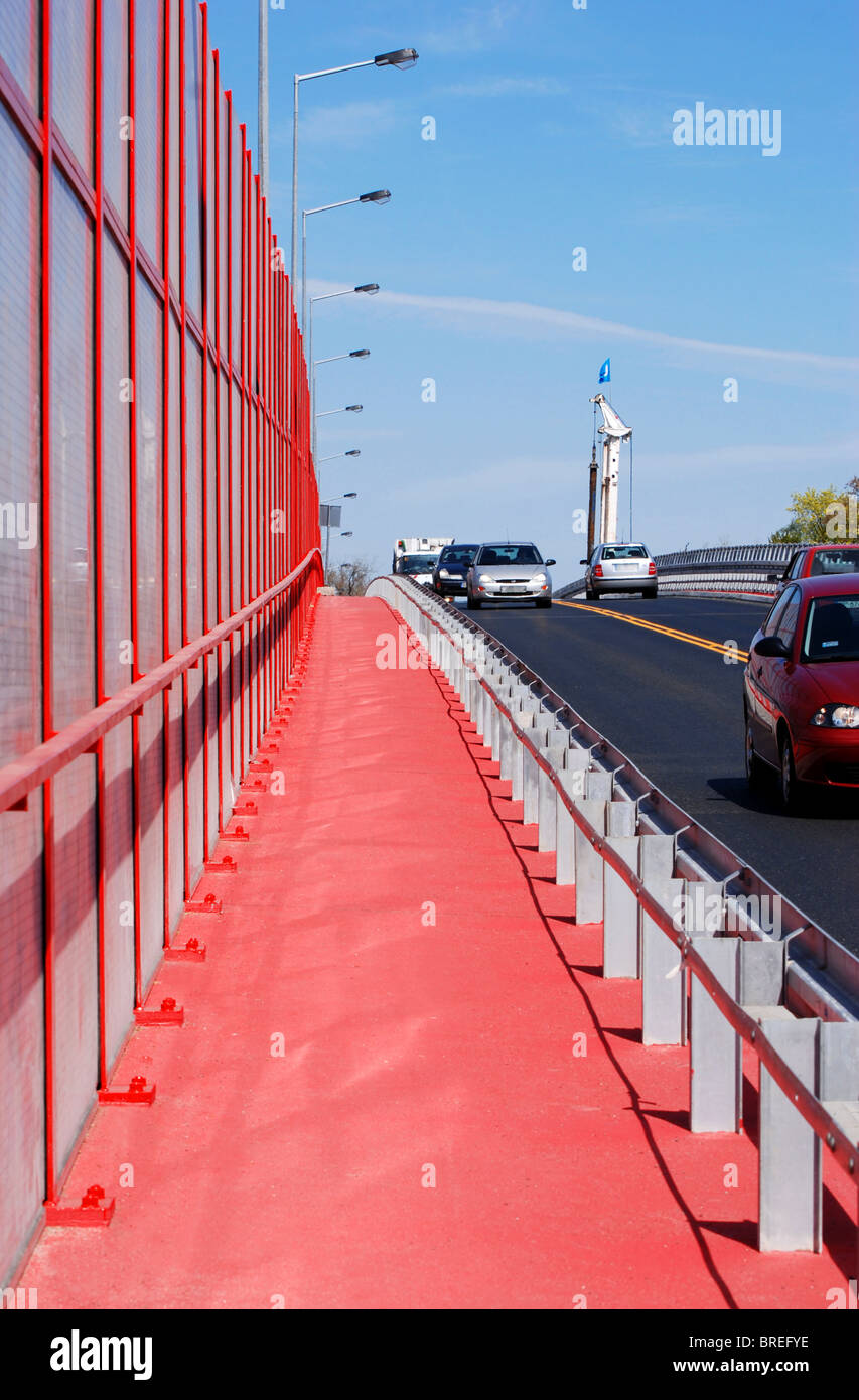 mitigating noise barrier or soundwall on roadway Stock Photo