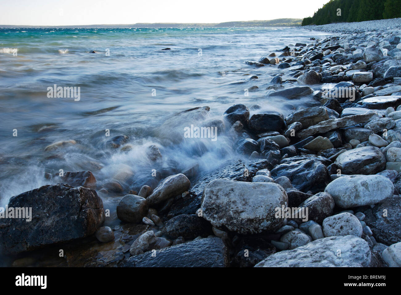 Waves of Georgian Bay meet the rocky shores at Dyer's Bay on the Bruce Peninsula. Stock Photo