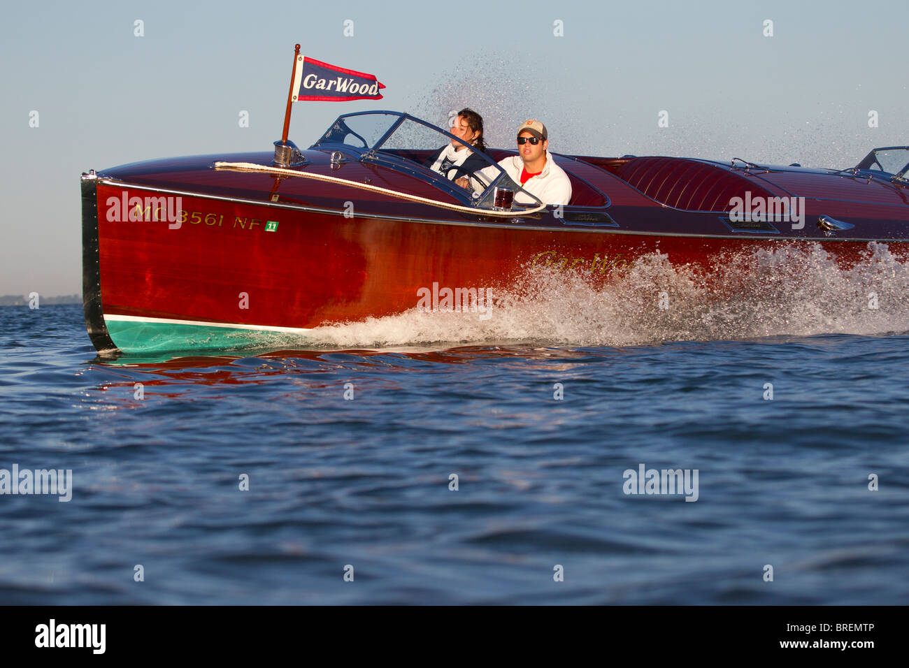 An antique, wooden Gar Wood boat in a high speed turn. Stock Photo