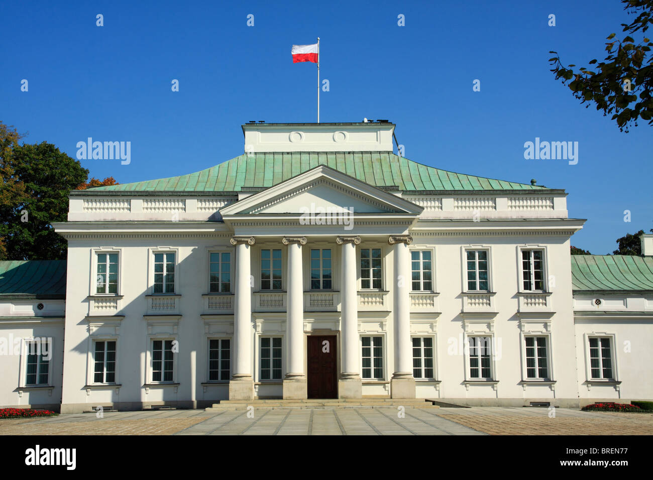 Belweder Palace former Polish Presidents house with Polish flag waving on the roof top. Stock Photo