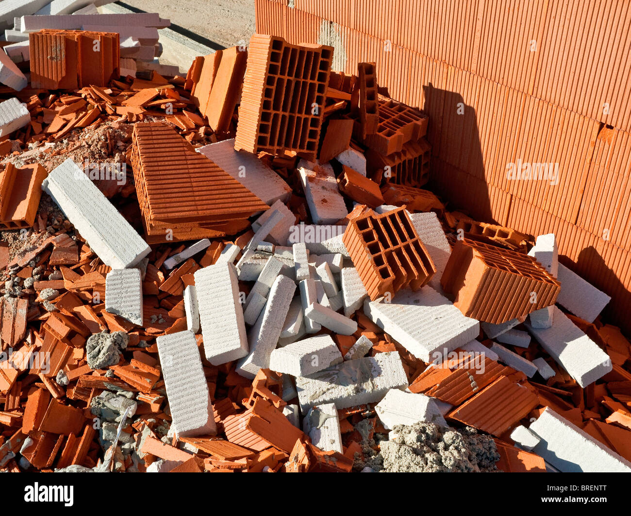 Broken, scrapped clay roof tiles and building materials on building site - France. Stock Photo