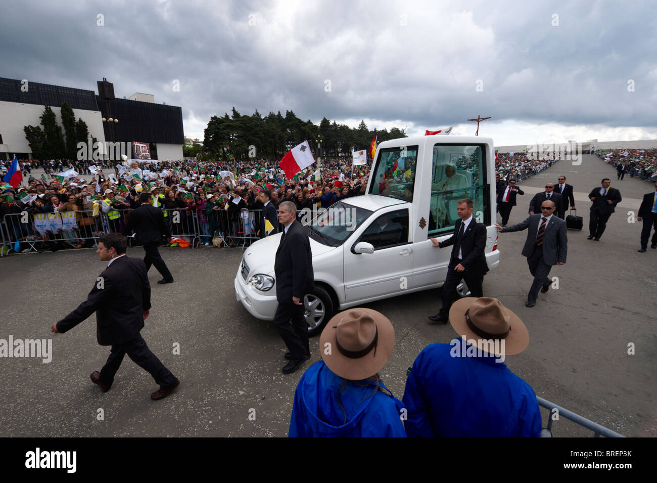 Pope Benedict XVI waves at pilgrims from inside his armored car at the Our Lady of Fatima shrine during his visit to Portugal Stock Photo