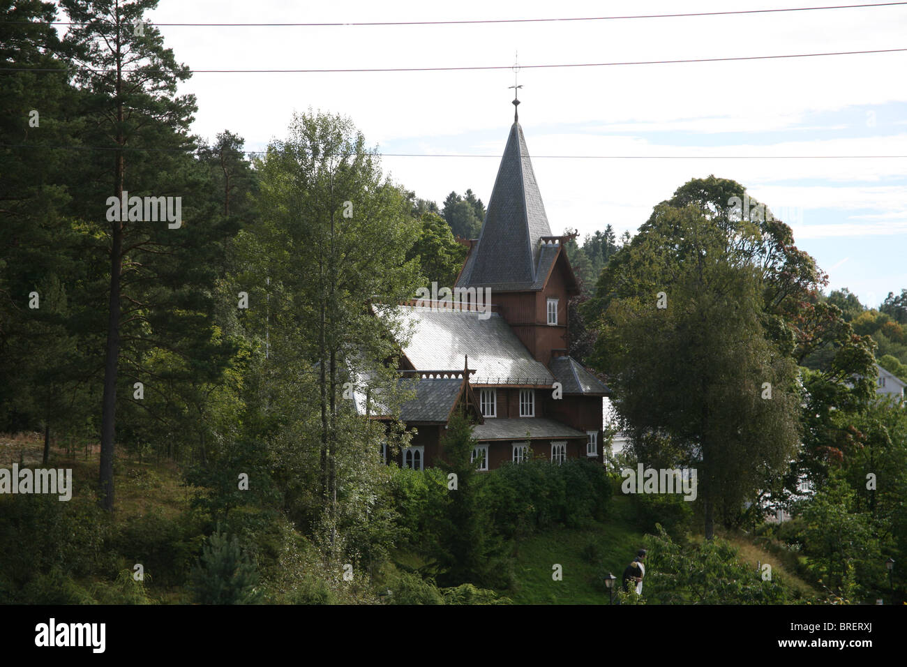 The old stave church, built in 1903, was a gift from Bolette Olsen. Hvitsten Stock Photo