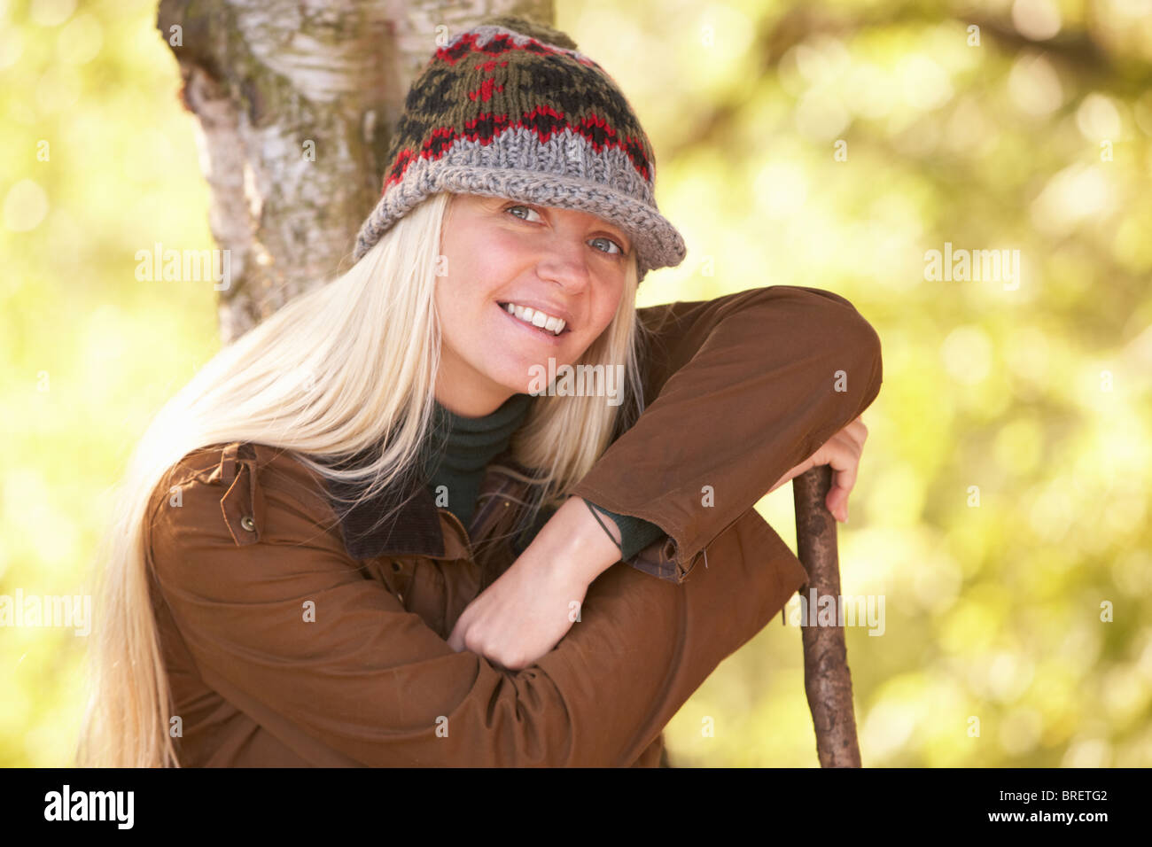 Woman carrying walking stick hi-res stock photography and images - Alamy