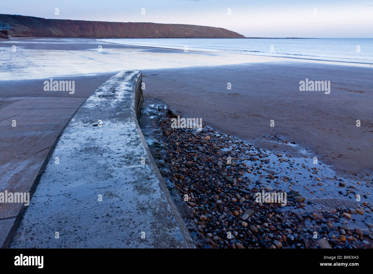 View of the beach at Filey in North Yorkshire England UK looking towards Filey Brigg