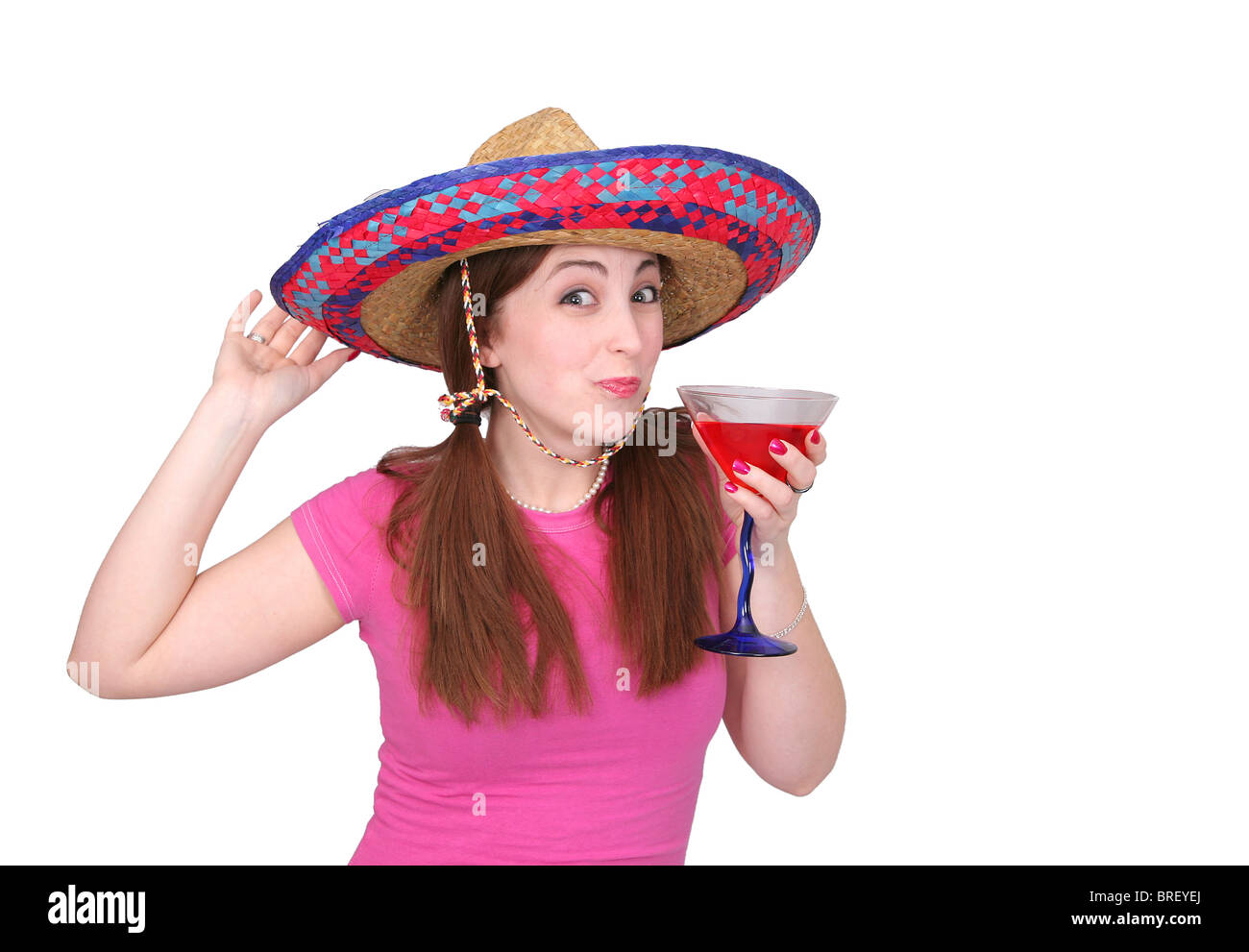 one young woman in pink drinking a fruity drink over white Stock Photo