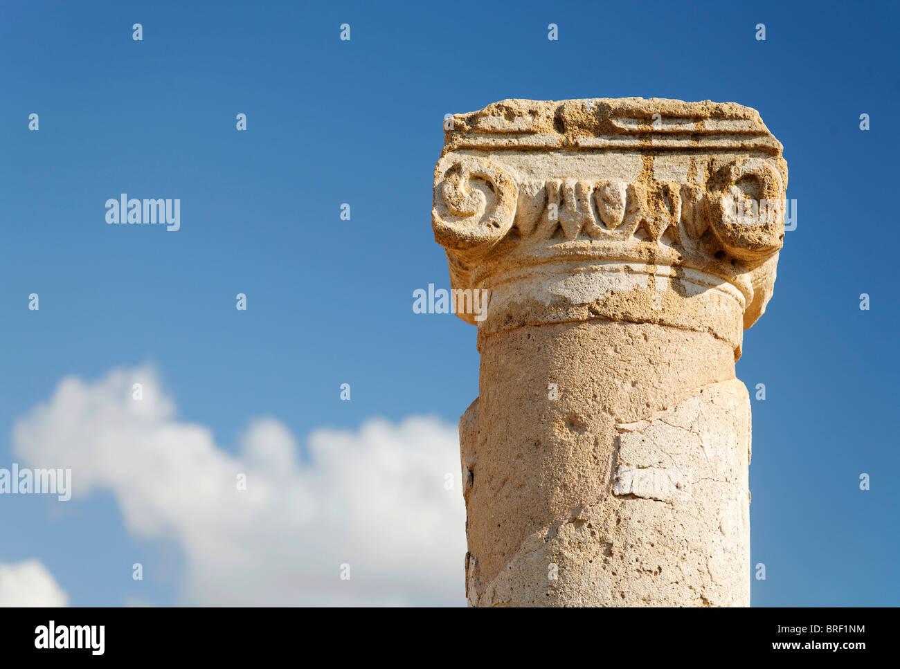 Ancient Greek column, capital, abacus, blue sky, white clouds, UNESCO World Heritage Site, Kato, Paphos, Pafos, Cyprus, Europe Stock Photo