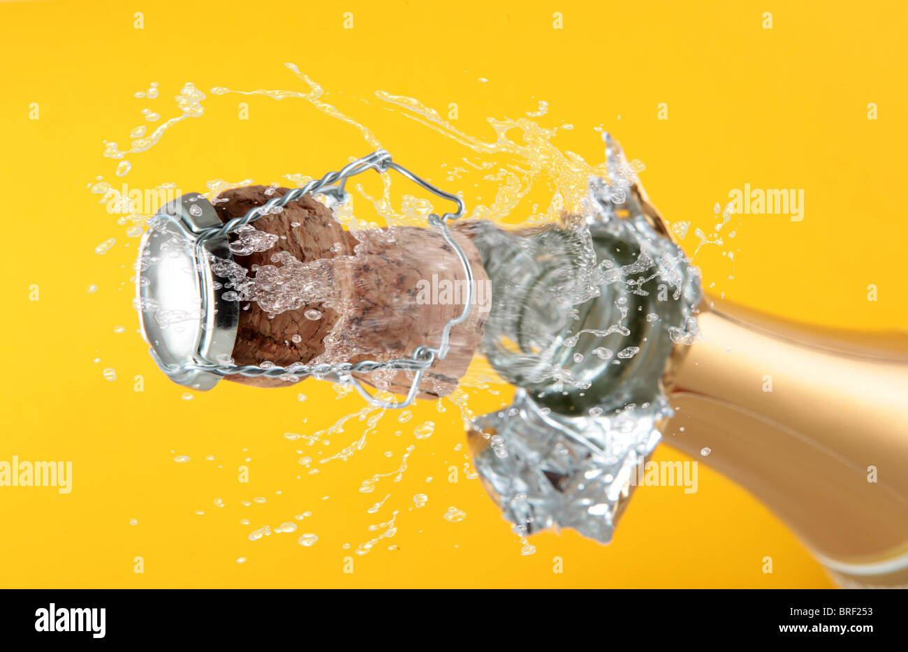 champagne bottle with shooting cork background Stock Photo