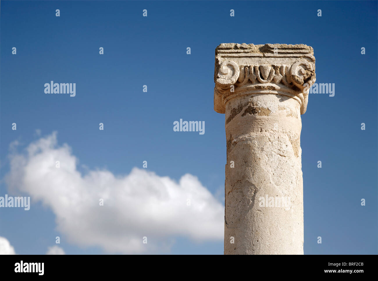 Ancient Greek column, capital, abacus, blue sky, white clouds, UNESCO World Heritage Site, Kato, Paphos, Pafos, Cyprus, Europe Stock Photo