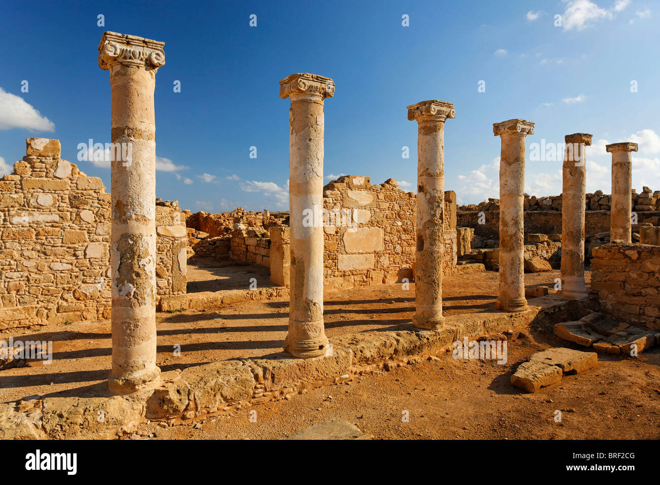 Ancient Greek columns in ancient walls, excavation site, UNESCO World