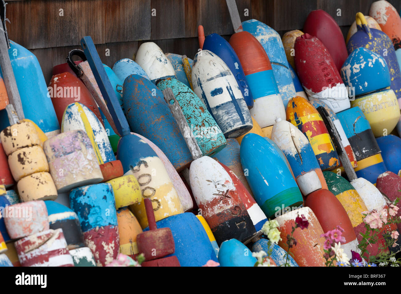 Colorful fishing buoys stacked outside a fishing hut. A large collection of  fishing floats or buoys Stock Photo - Alamy