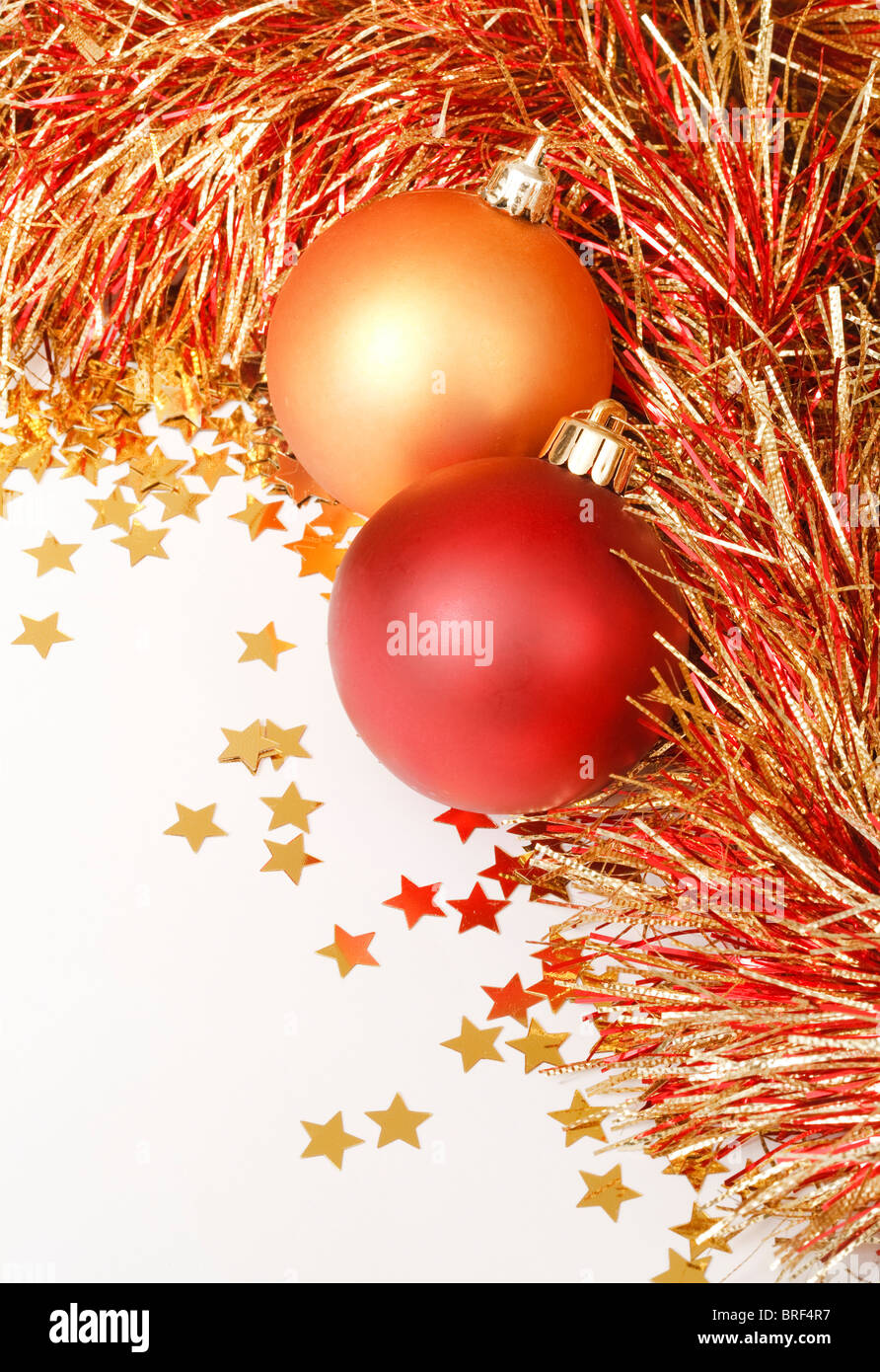 Festive Christmas design with baubles, tinsel and confetti Stock Photo