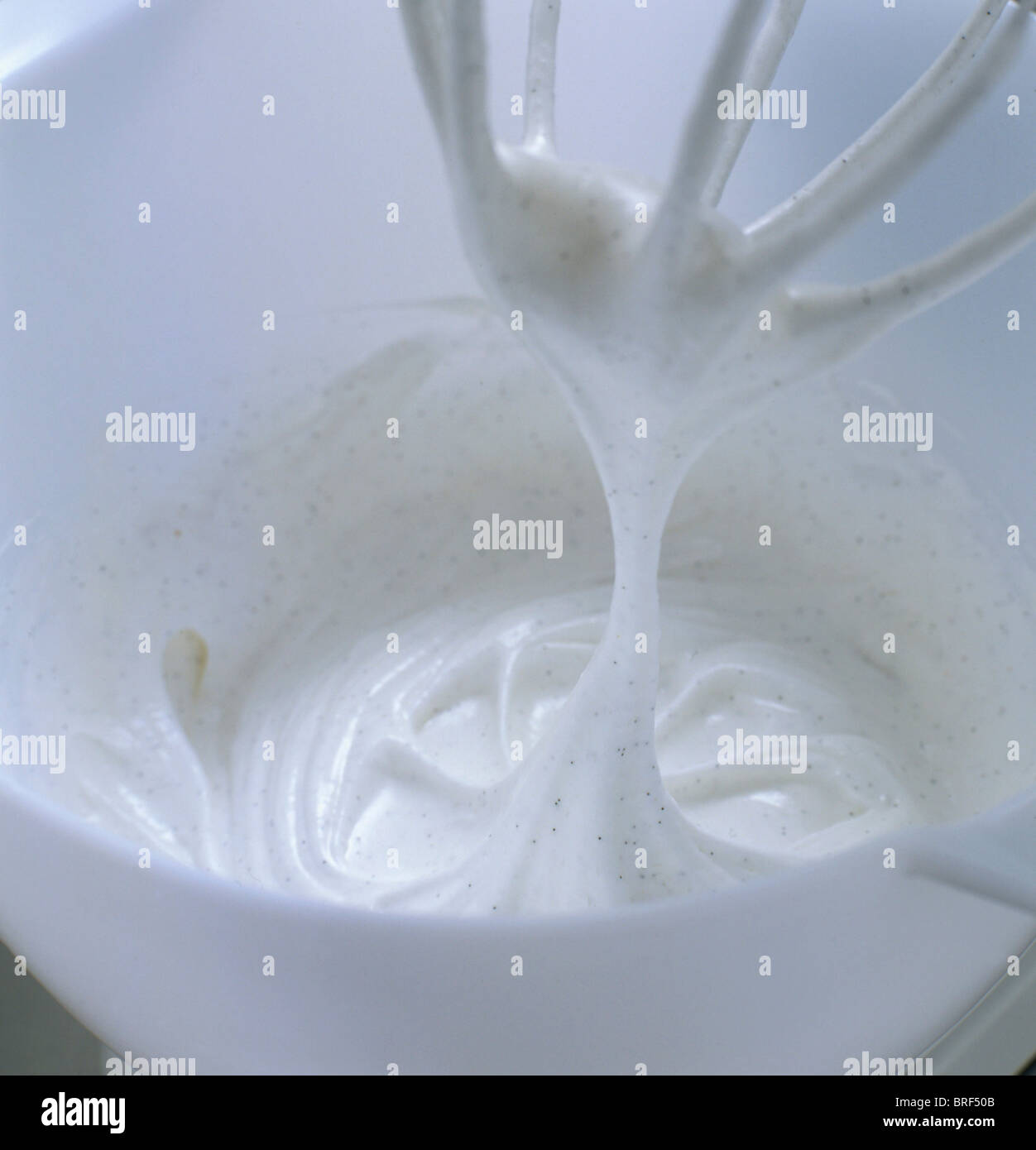 Whisked egg whites with vanilla in bowl Stock Photo Alamy