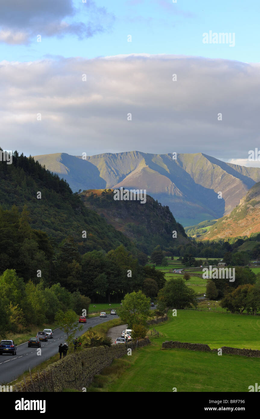 A view down the A591 road to Keswick with Blencathra towering over St Johns in the Vale Stock Photo