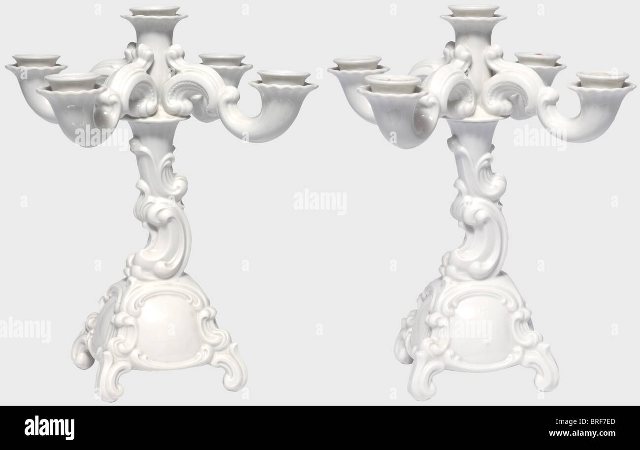 Two five-colour baroque candelabra, designed by Franz Nagy. Model number 21a. White glazed porcelain. Manufacturer's marks in underglaze green on the bottom, one in an octagon with the number '21', and one with the monogram 'FNY'. Height of each 32 cm. Wax remnants, undamaged. Rare. historic, historical, 1930s, 1930s, 20th century, object, objects, stills, clipping, clippings, cut out, cut-out, cut-outs, Stock Photo