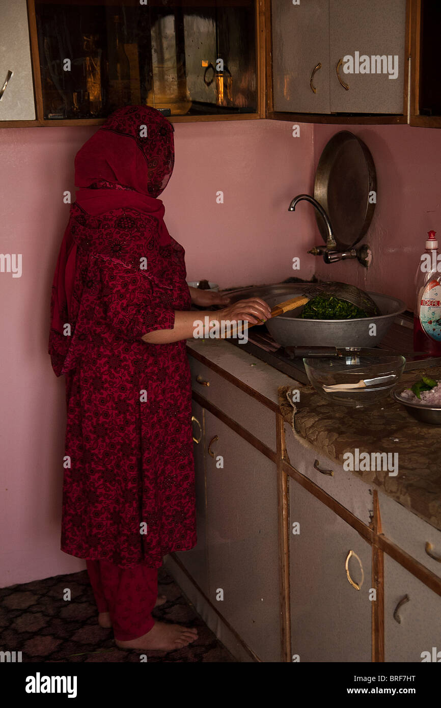 Woman cooking in Kabul kitchen Stock Photo