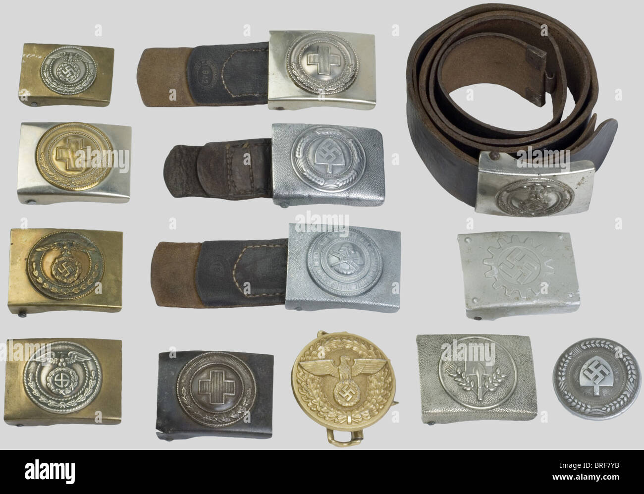 A group de belt buckles, including three for enlisted men S.A. (two for belts and a small size one), one D.A.F., one for enlisted man N.S.S.K. with its leather, a first version (early model) R.A.D. for enlisted men (volunteer), one for R.A.D. enlisted men, one for officer R.A.D. (one loop missing), one round N.S.D.A.P. leader belt buckle, etc., historic, historical, 1930s, 1930s, 20th century, object, objects, stills, clipping, clippings, cut out, cut-out, cut-outs, utensil, piece of equipment, utensils, item, items, Stock Photo