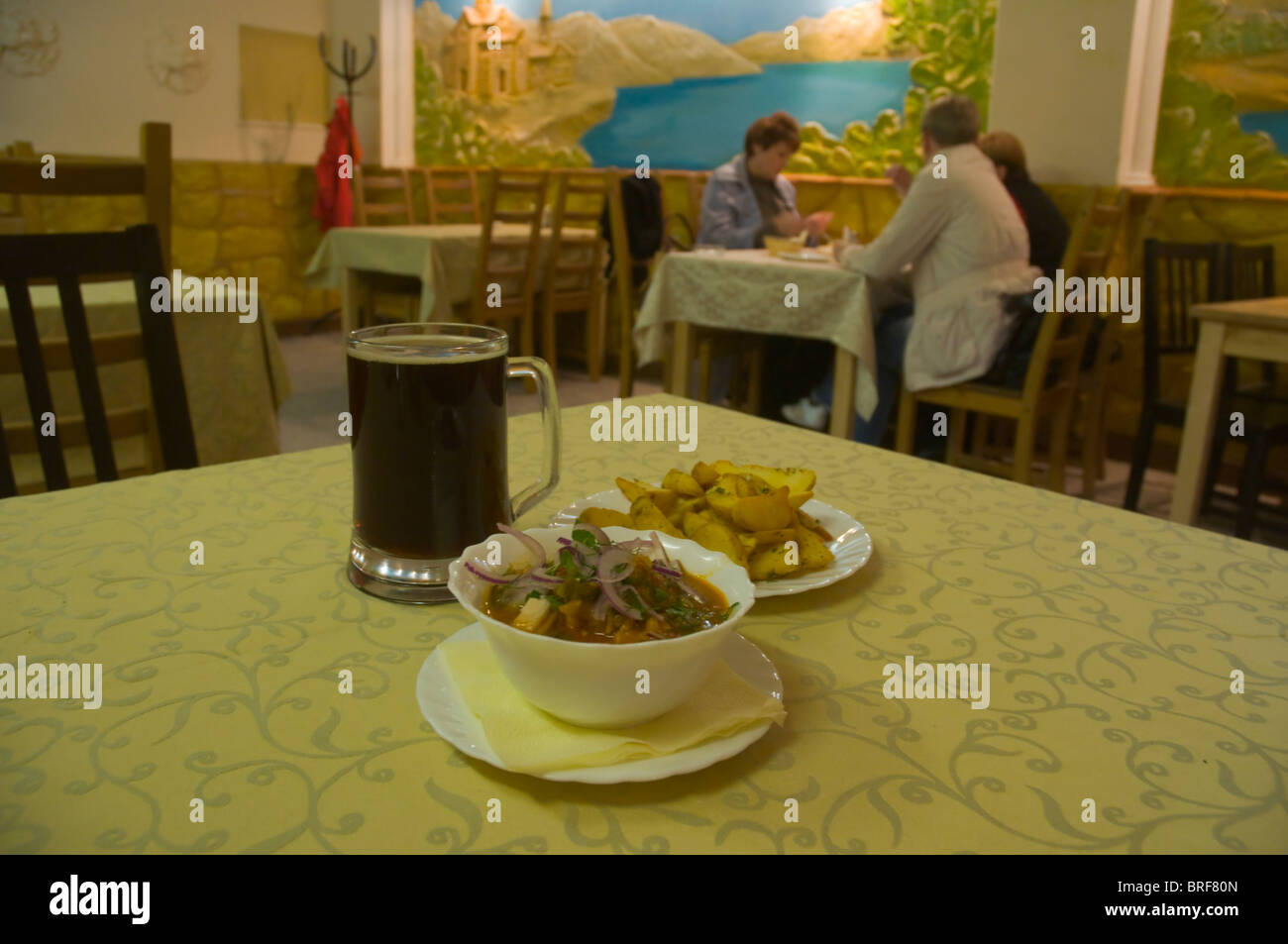 Meal and a dark beer in a Georgian Restaurant along Nevsky Prospekt street St Petersburg Russia Europe Stock Photo