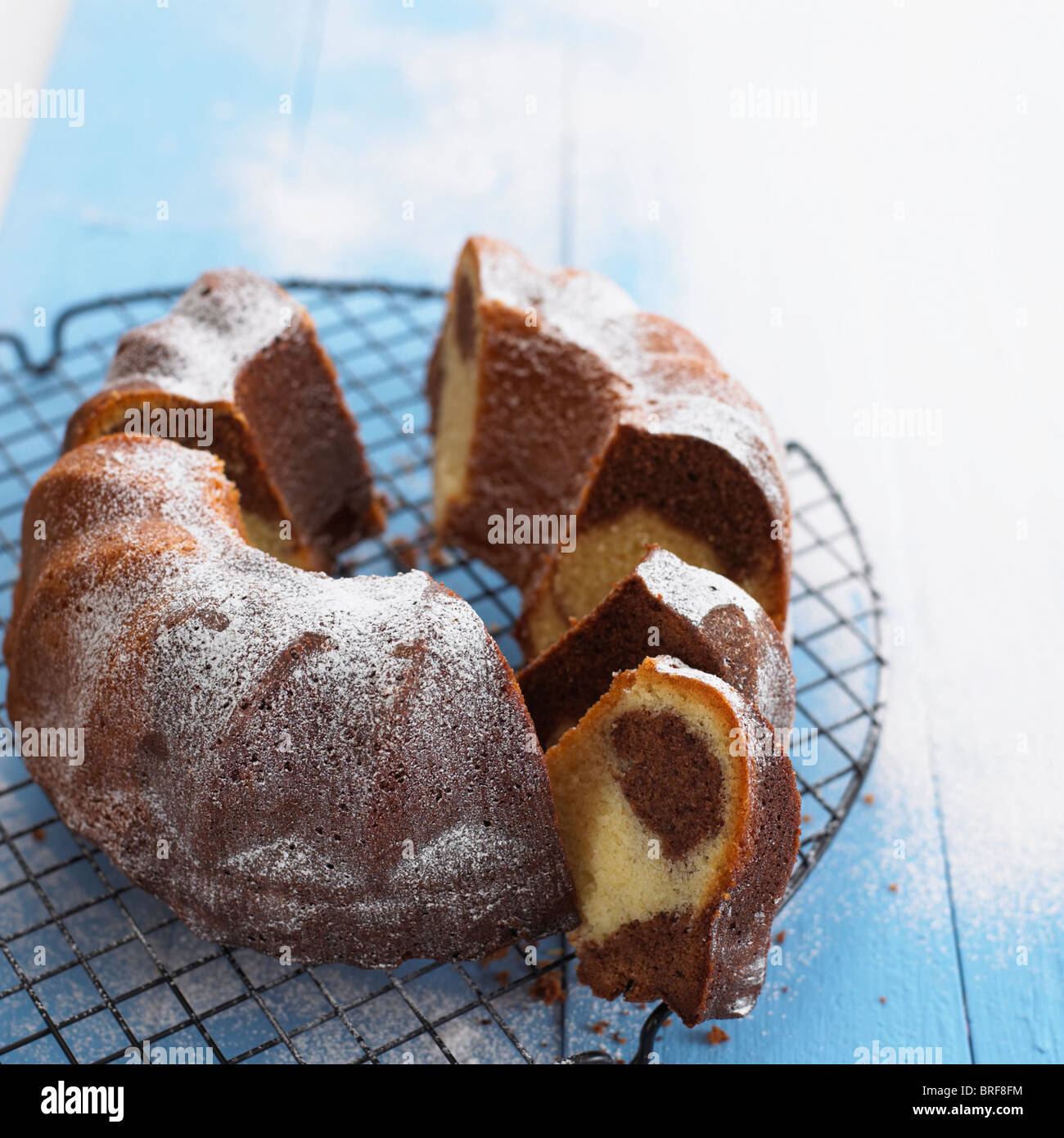 Marble bundt cake cooling on wire rack Stock Photo Alamy