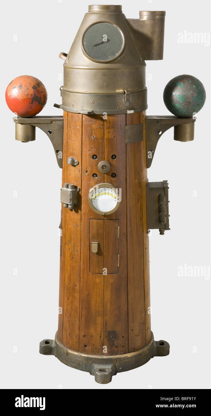 A compass, from the tugboat H.M.S 'Reward'. A wooden, gimbal mounted, liquid filled compass with bronze fittings, made by Lilley Stock Photo